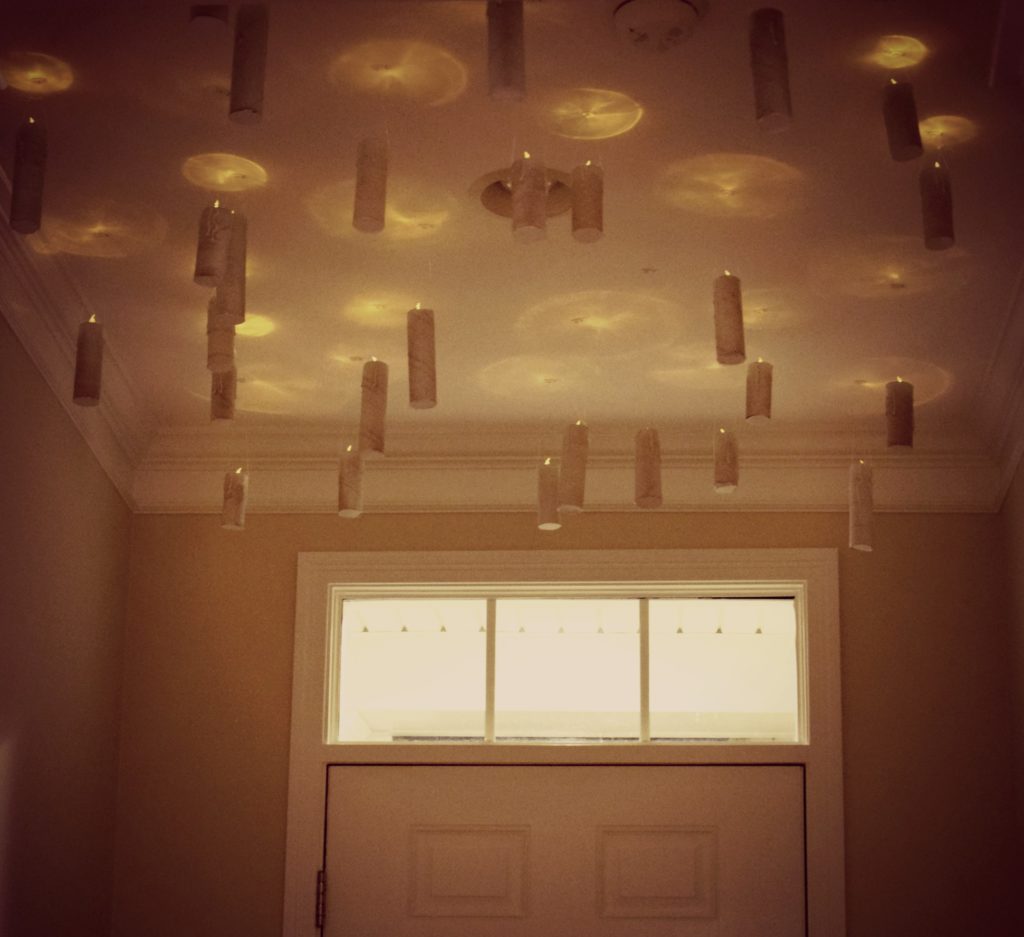 Need help hosting a halloween party? Check out this post for easy Halloween Decorations. For some extra fun throw a costume contest. These free Halloween party printables. This post is filled with DIY Halloween decorations perfect for your party like these DIY hanging candles.